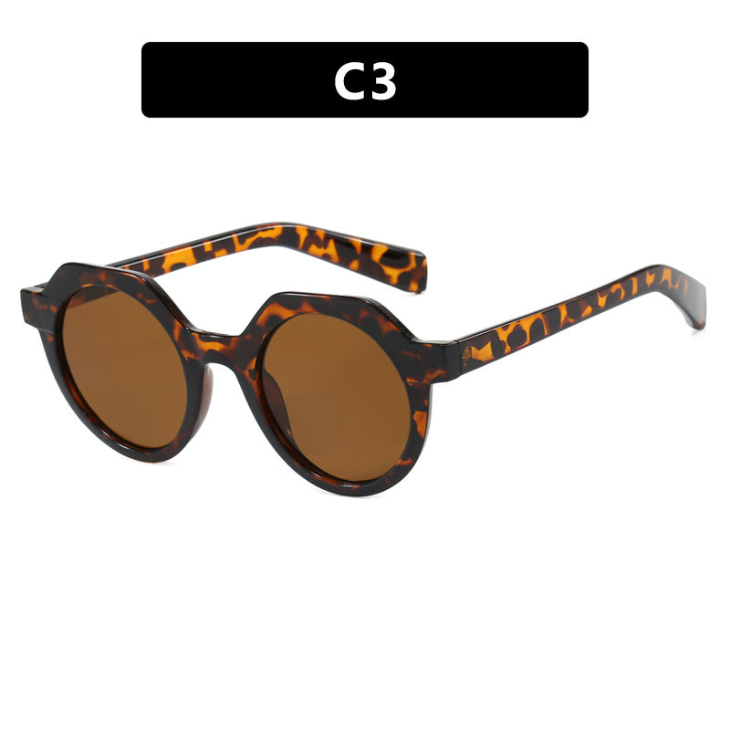 Ladies extravagant round sunglasses with colored accented frame Stornfield