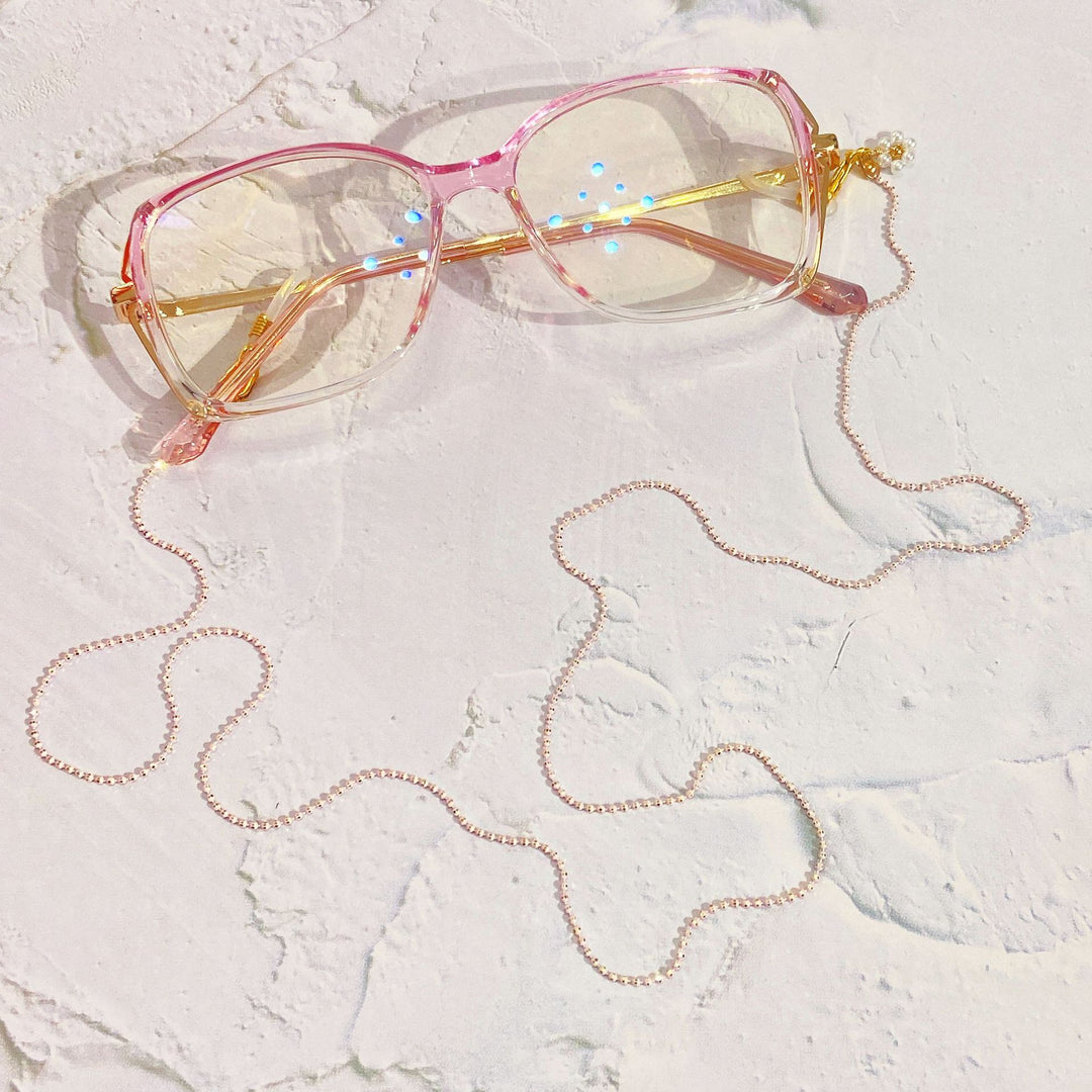 Eyewear chain with pearls and gold pendants Stornfield