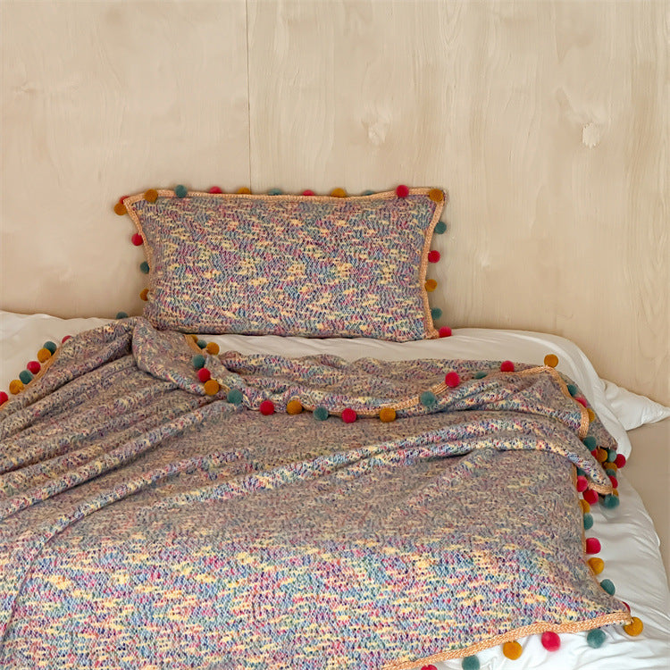 Extra soft cuddly throw blanket with pom-pom trim and mottled chenille relief Stornfield