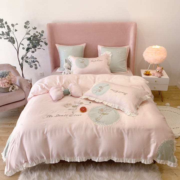 Satin bedding set with fairy embroidery, ruffled hem and decorative pillowcases