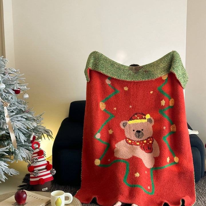 Cozy blanket in knit look with large animal face and soft terry surface