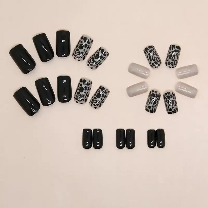 Acrylic nail set with stylish leopard pattern and elegant accents Stornfield