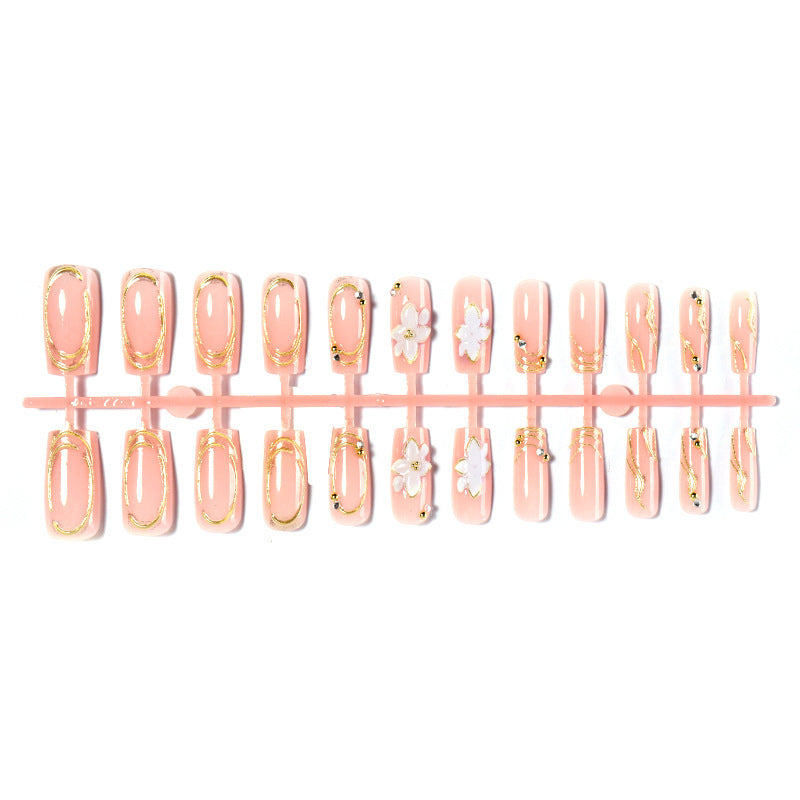 Artificial nail set with floral embellishments and gold accents Stornfield