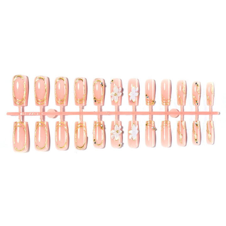 Artificial nail set with floral embellishments and gold accents Stornfield
