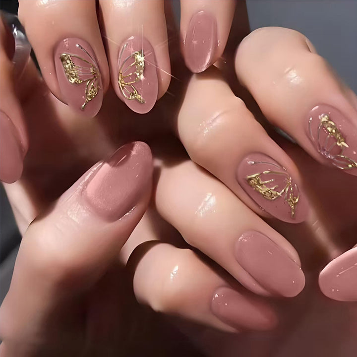Acrylic nail set with elegant golden accents and shimmering finish Stornfield