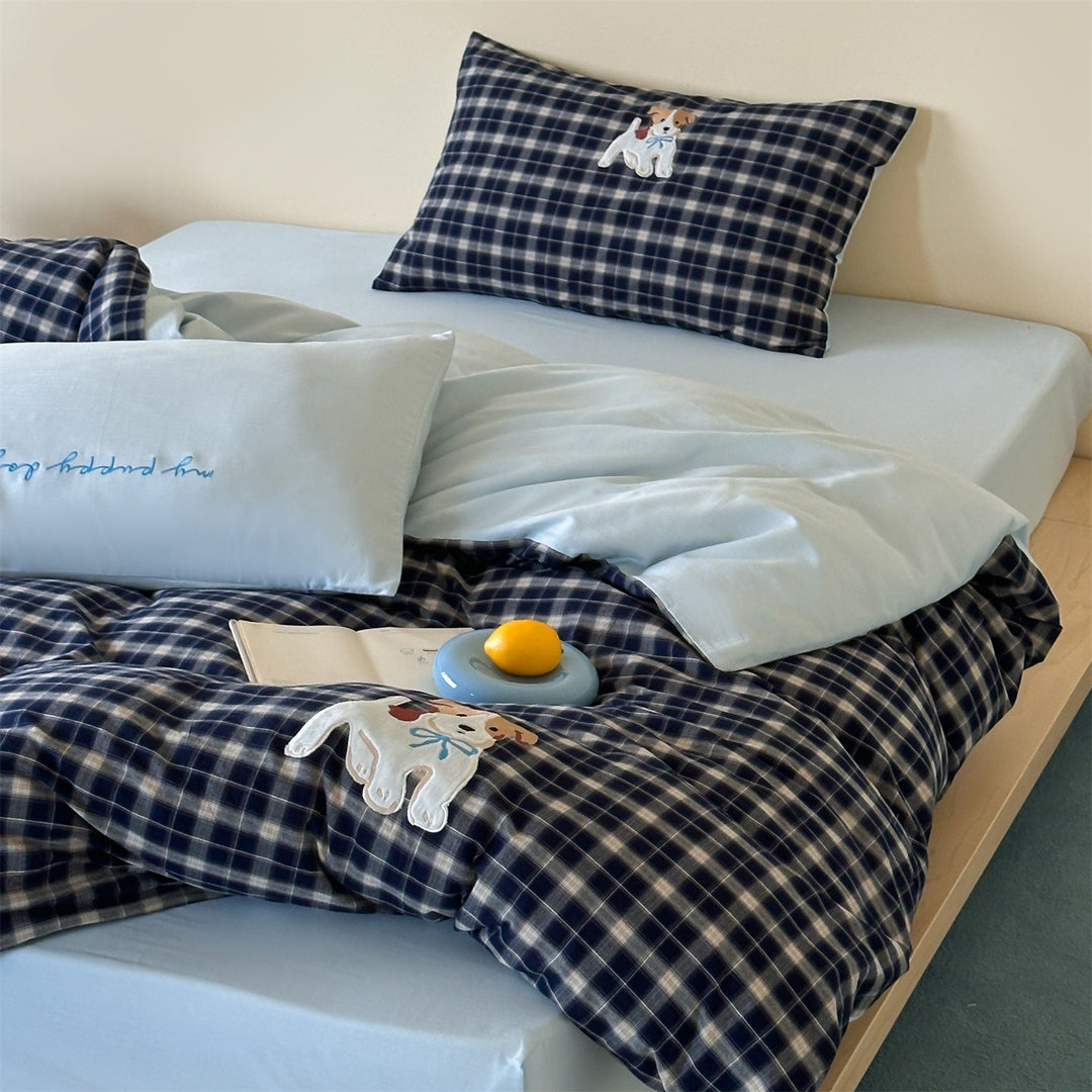 fine striped bed linen set with embroidered cat motif and soft cotton satin