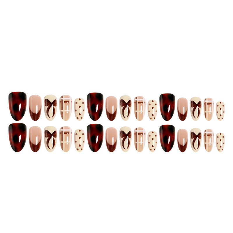 Artificial nail set with elegant bow and caramel designs Stornfield
