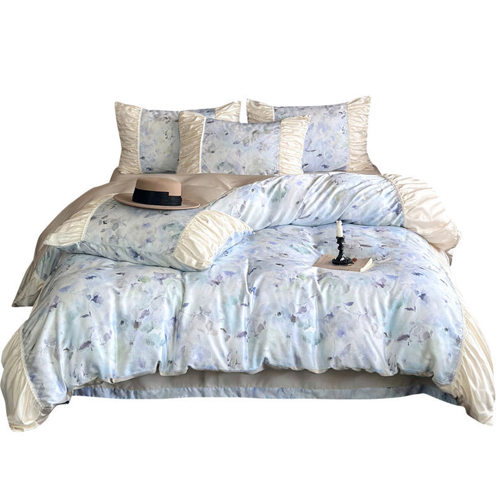 Elegant satin bedding set with watercolor floral pattern, ruffles and gathered pillowcases