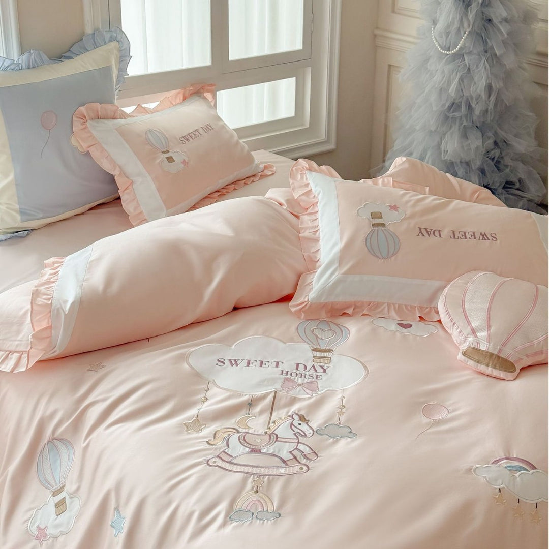Bedding set in vintage girl style with ruffled hem, hot air balloon applique, and extra soft satin