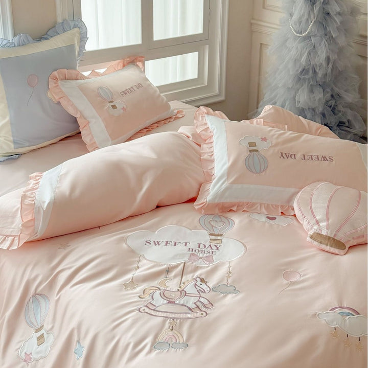 Bedding set in vintage girl style with ruffled hem, hot air balloon applique, and extra soft satin