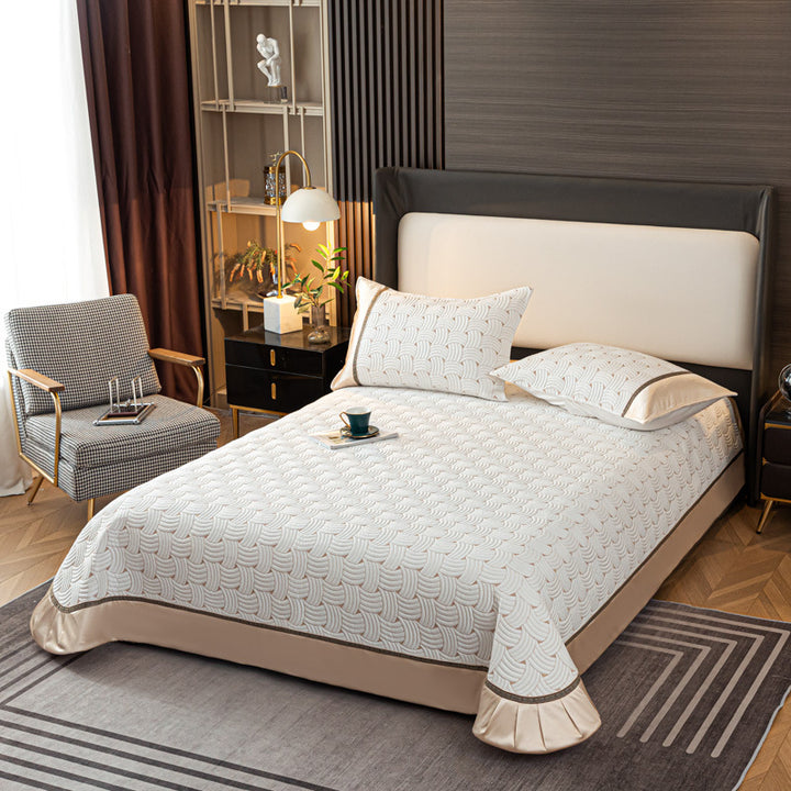 Quilted bedspread set with satin ruffle and geometric wave relief
