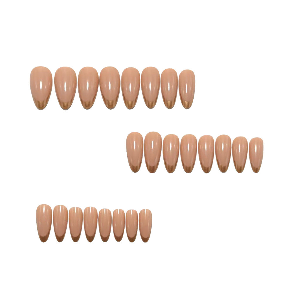 Artificial nails in elegant stiletto design with golden accents Stornfield
