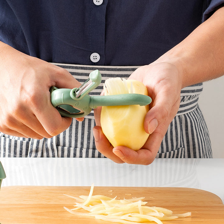 Multifunctional vegetable and fruit cutter with safety mechanism Stornfield