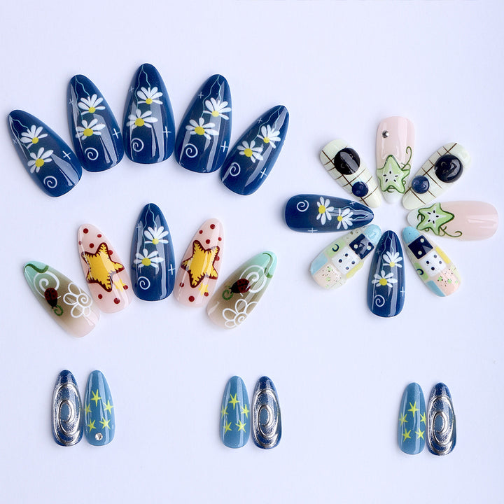 Artificial nails with creative maritime designs and 3D elements Stornfield