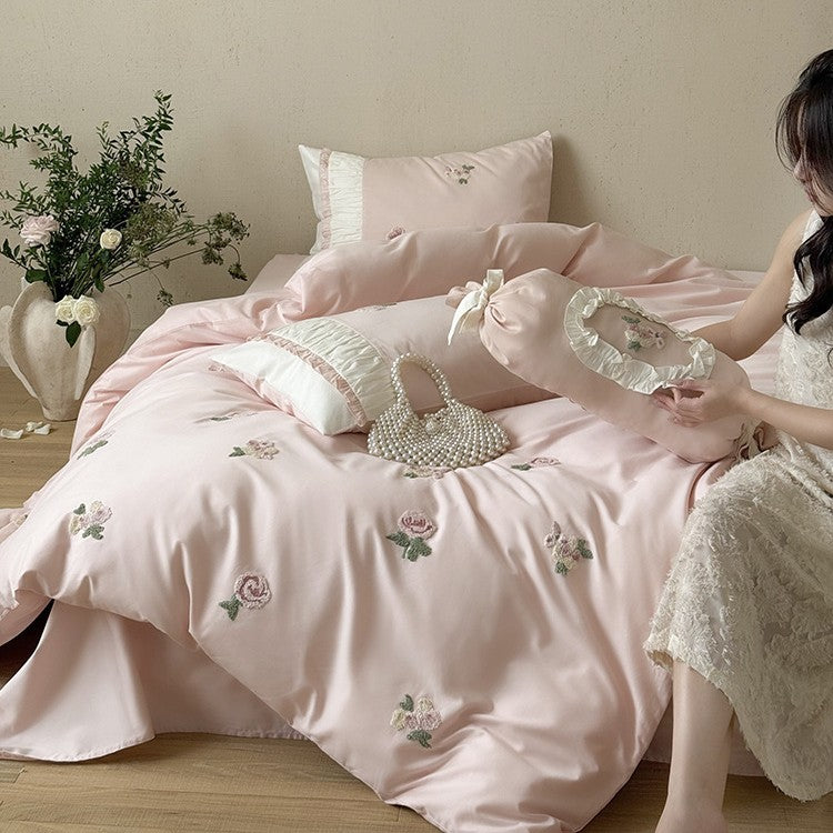 Luxurious cotton bedding set with delicate rose embroidery and ruffles