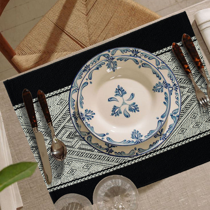 Woven rectangular table mats in a set with ethnic geometric pattern and easy-care cotton blend