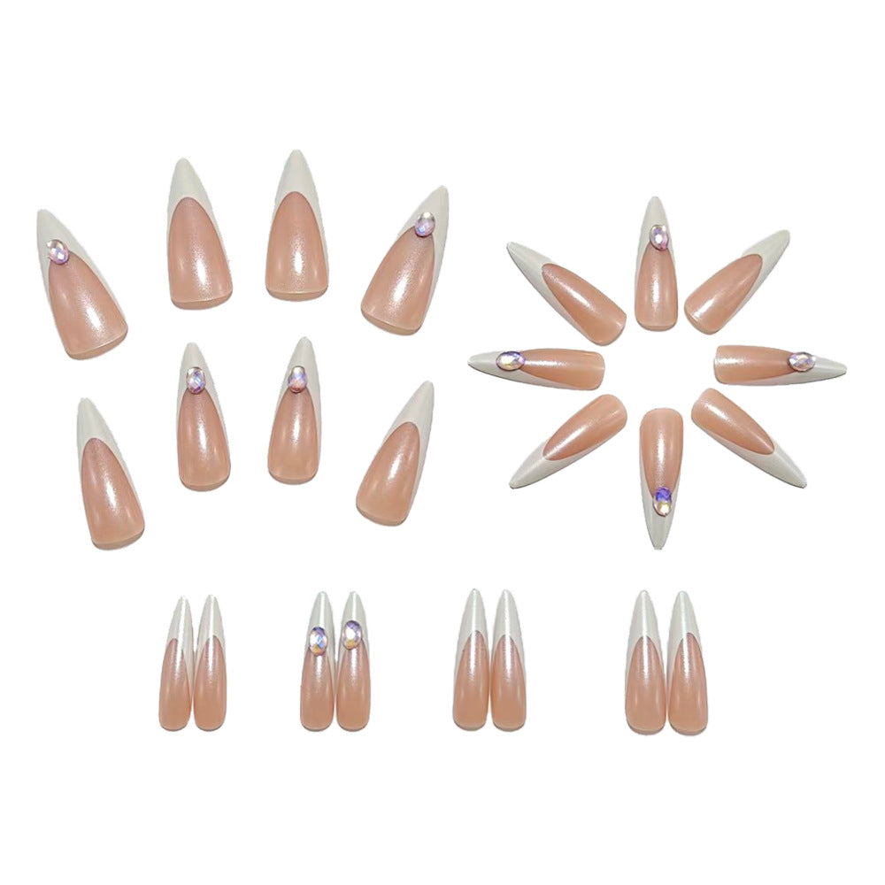 Artificial nails in modern stiletto design with glitter accents Stornfield