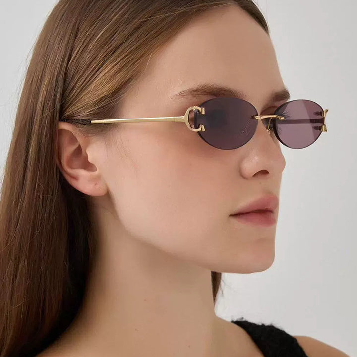 Women's elegant oval-shaped sunglasses with fashionable metal frame Stornfield