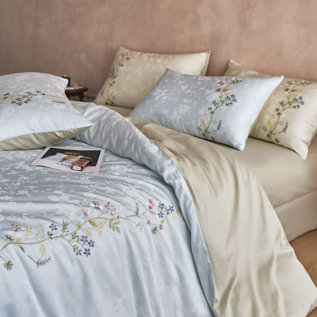 Satin bedding set with fine floral embroidery and jacquard structure