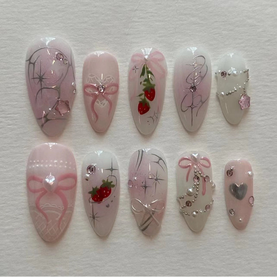 Artificial nail art with romantic design and glitter accents Stornfield