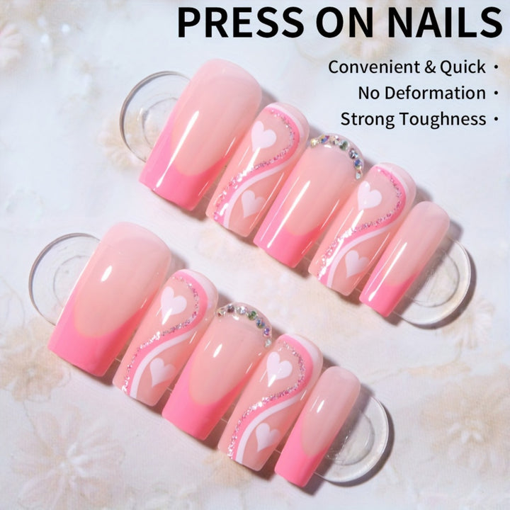 Artificial nail set with romantic heart designs and glamorous accents Stornfield