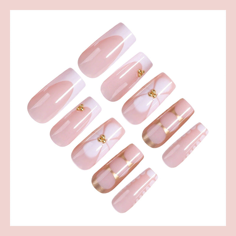 Artificial nail set with elegant gold embellishments and romantic accents Stornfield