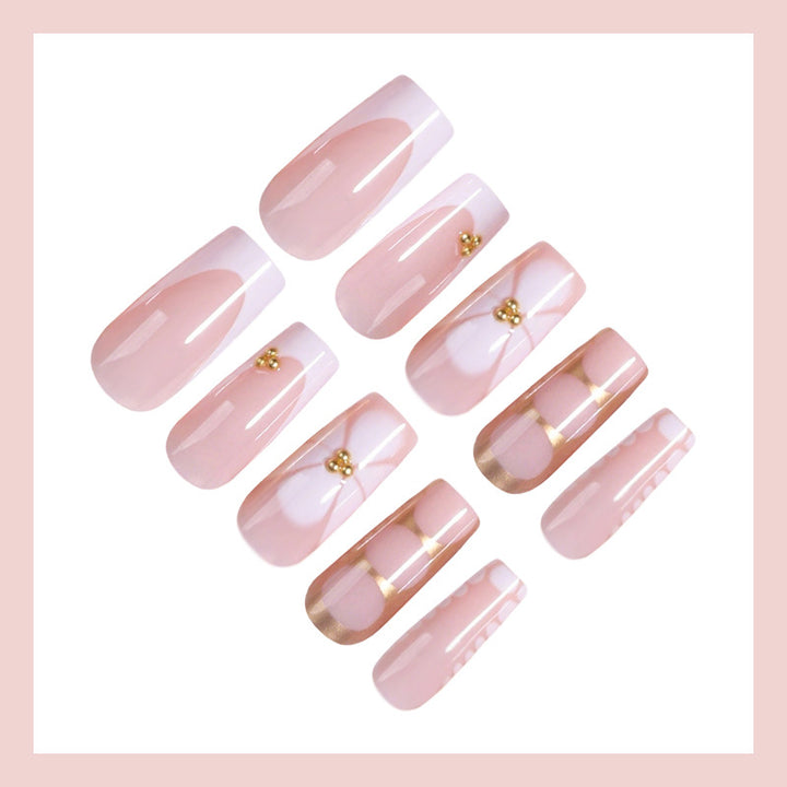 Artificial nail set with elegant gold embellishments and romantic accents Stornfield