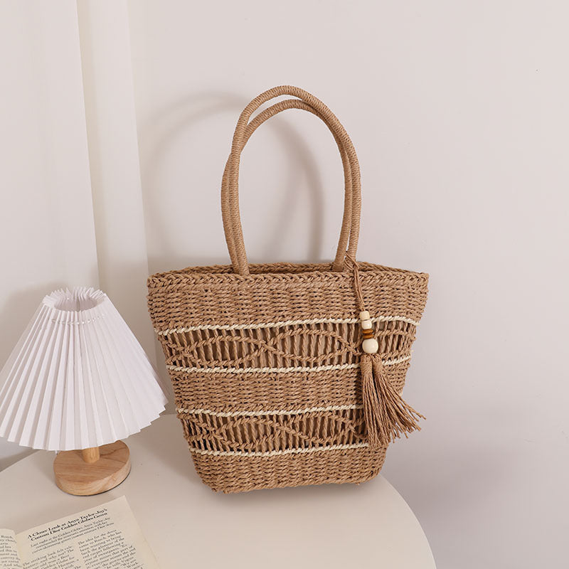 Handcrafted straw tote bag with decorative tassel detail Stornfield