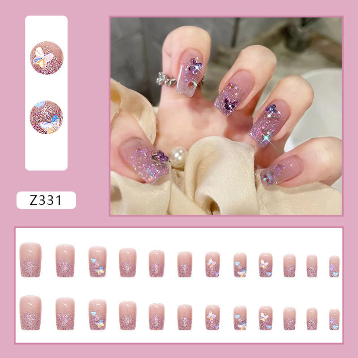 Glamorous artificial nails with glitter and floral accents Stornfield