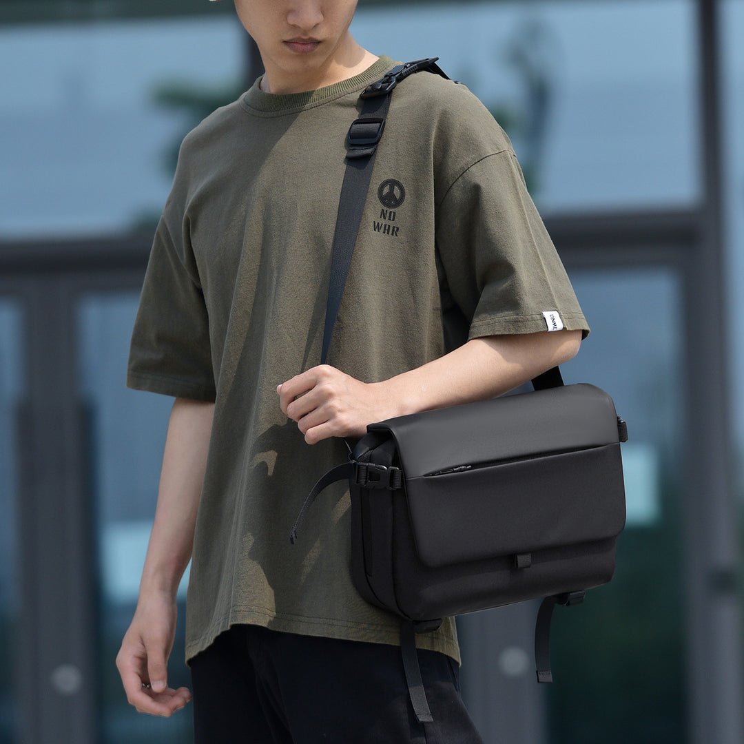 Messenger bag with versatile compartments and water-repellent material Stornfield
