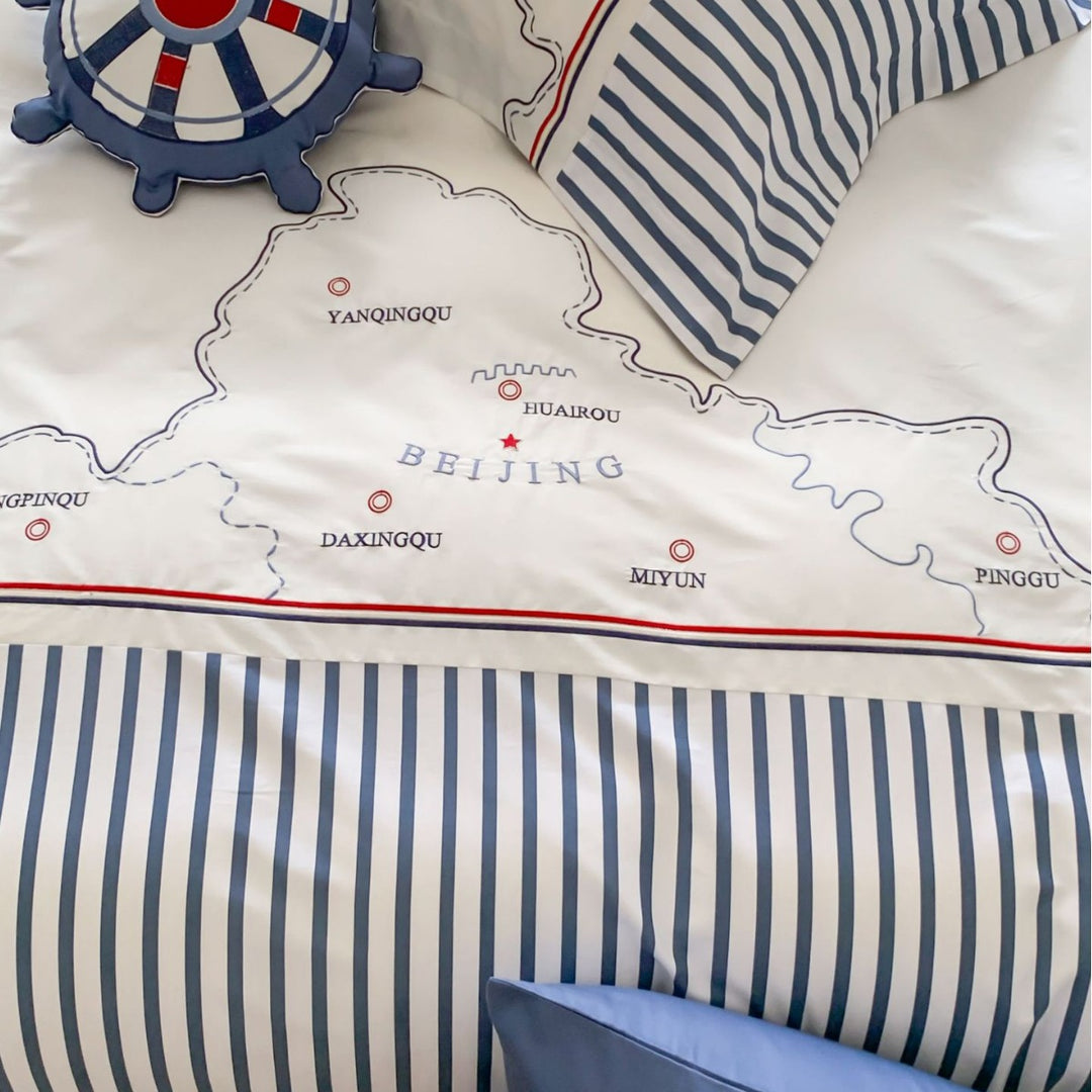 Maritime children's duvet cover set with cartographic print, fine striped border and pillowcases
