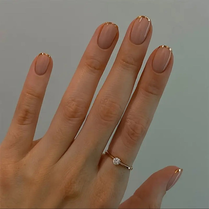 Nail art set with elegant gold accents Stornfield