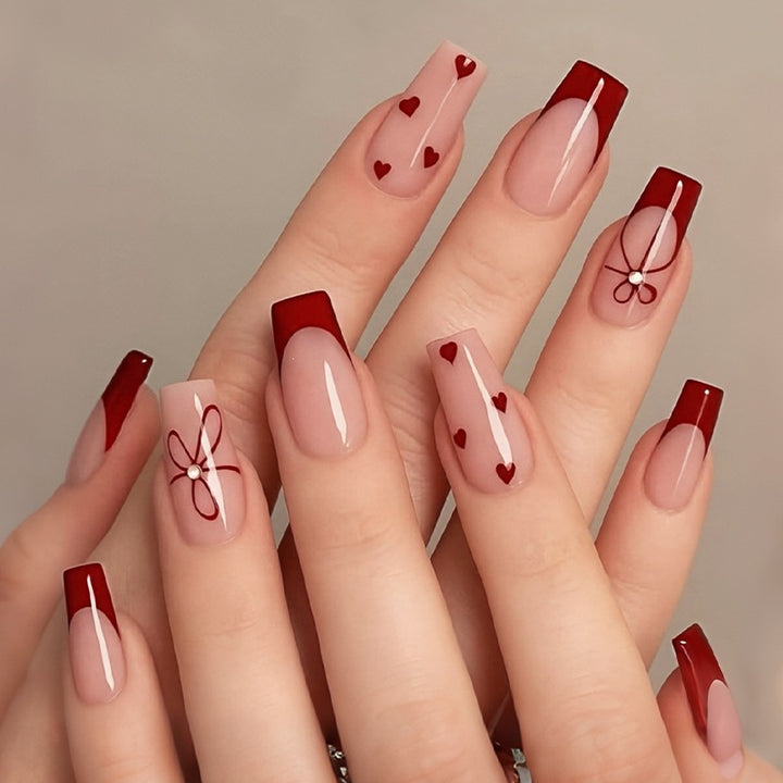 Artificial nail set with stylish hearts and elegant accents Stornfield