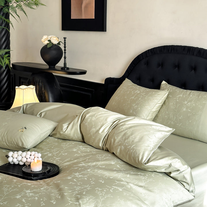 High-gloss satin bedding set with subtle floral jacquard and breathable comfort lining