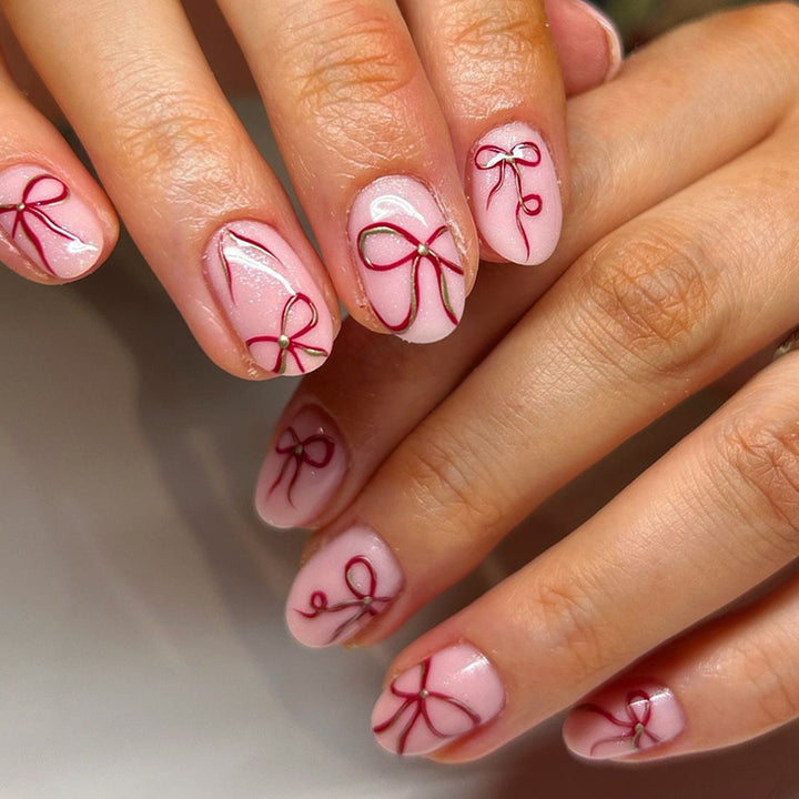 Artificial nail design with bow motifs Stornfield