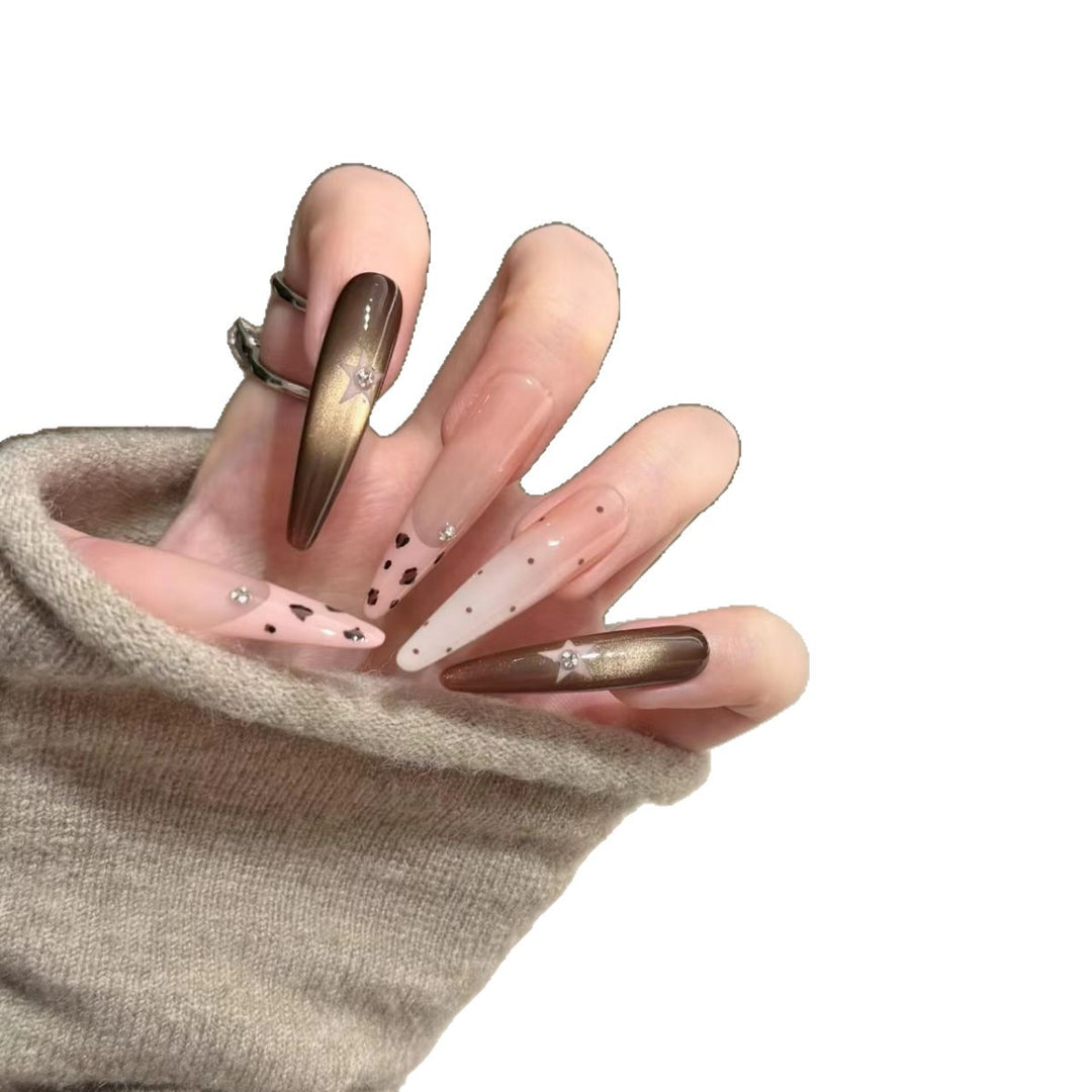 Artistic Stiletto Nail Extensions with Patterned Designs