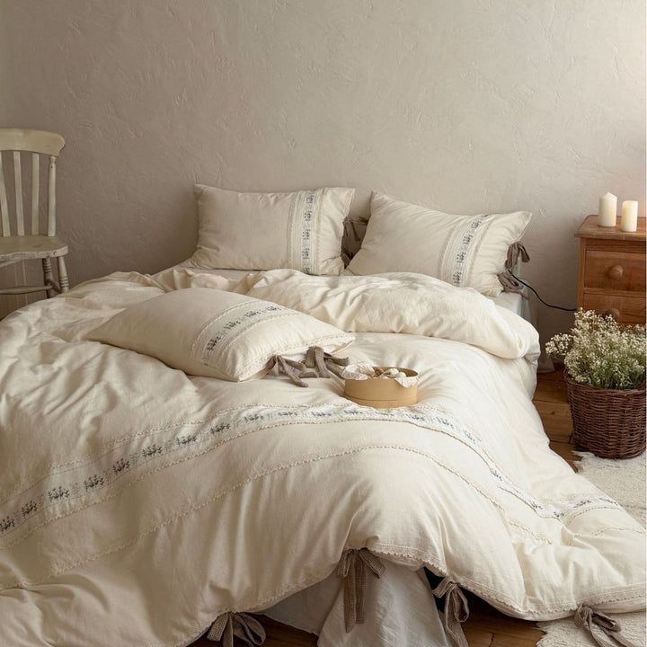 Luxurious cotton bedding set with floral embroidery and lace trim