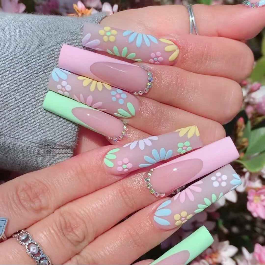Artificial nail set with floral 3D embellishments and rhinestone accents Stornfield