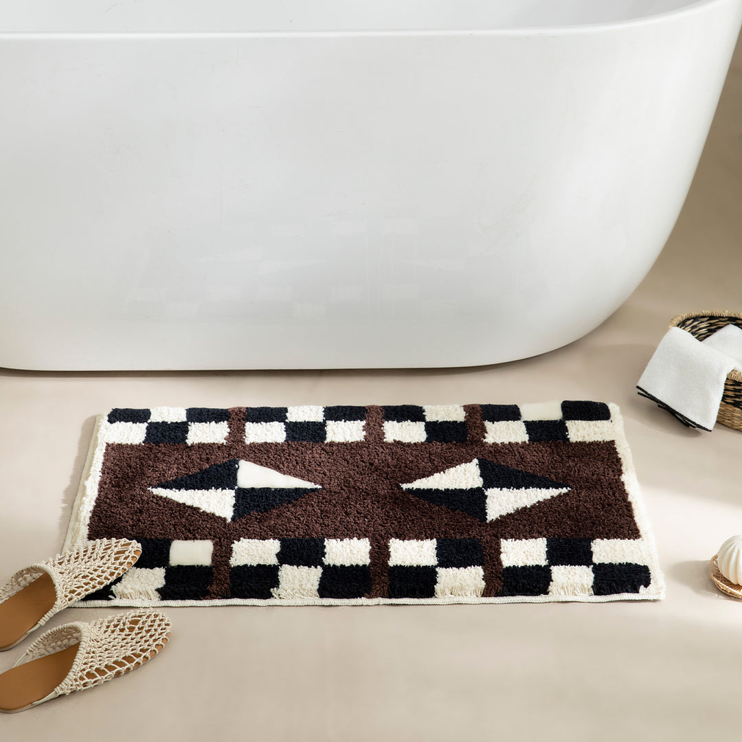 Tufted, soft bath mat with geometric ethnic pattern and non-slip underside Stornfield