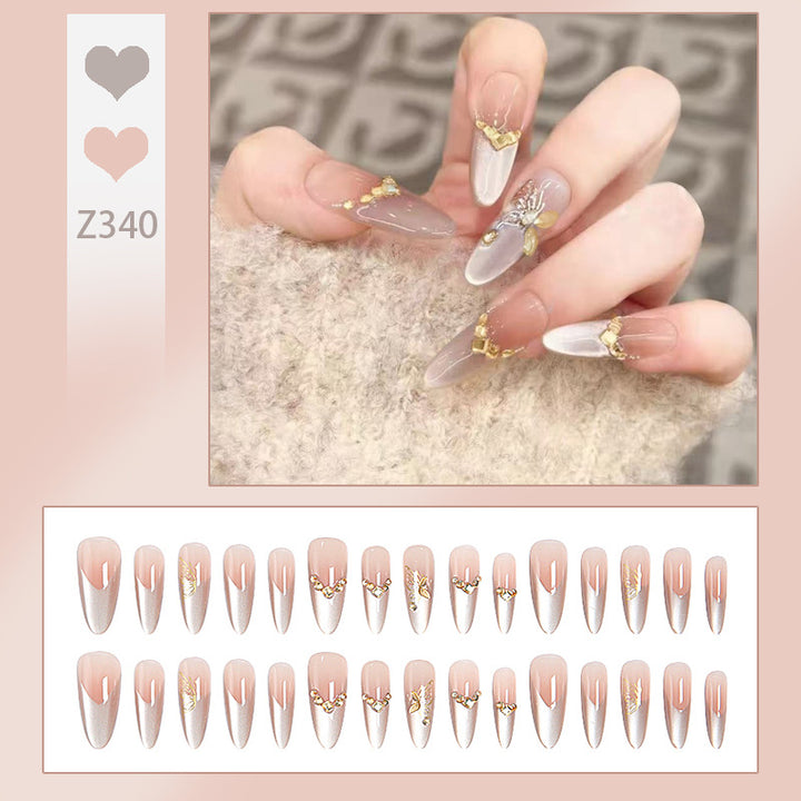 Glamorous art nails with elegant golden details Stornfield