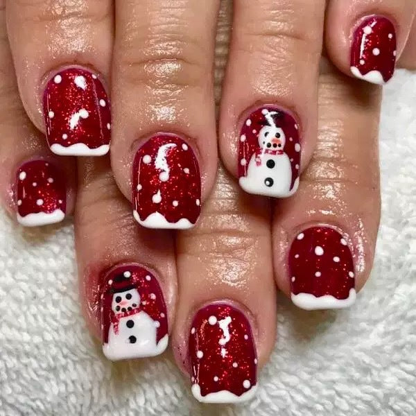 Artificial nail set with festive snowman motifs and glitter accents Stornfield