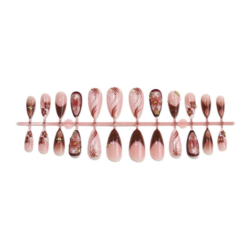 Acrylic nail set with elegant 3D flower accents and glamorous designs Stornfield
