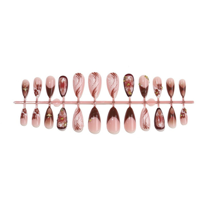 Acrylic nail set with elegant 3D flower accents and glamorous designs Stornfield