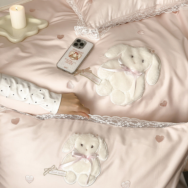 Luxurious satin bedding set with plush bunny appliqué and lace trim
