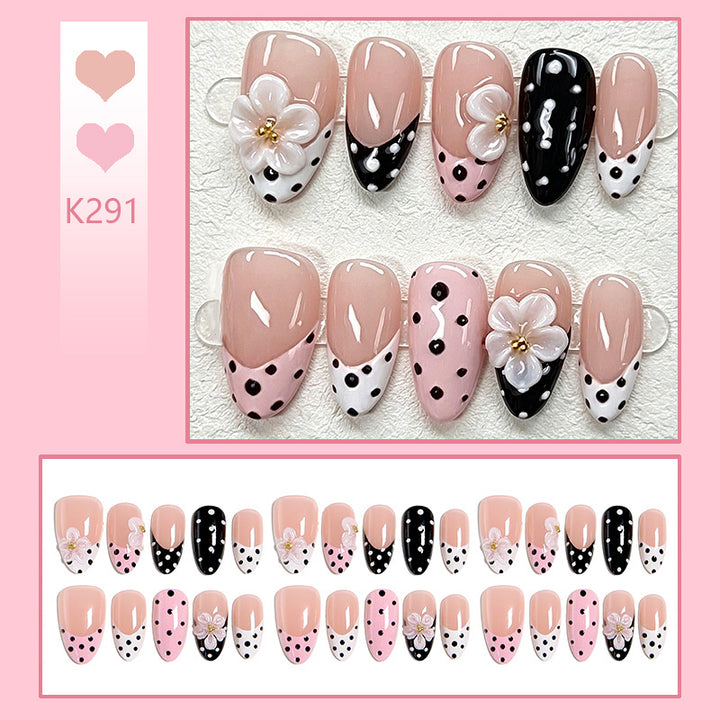 Nail art set with floral accents and elegant dots Stornfield