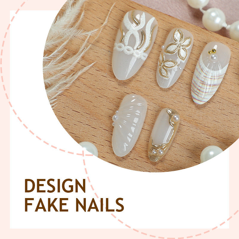 Artificial nail set with luxurious gold embellishments and elegant natural motifs Stornfield