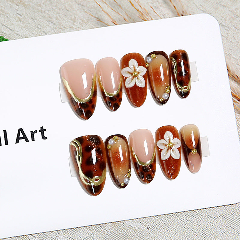 Elegant artificial nails with floral and animal motifs Stornfield