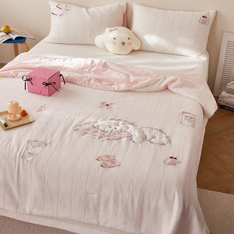 Quilted bedding and throw set with appliquéd plush puppy made of cotton muslin