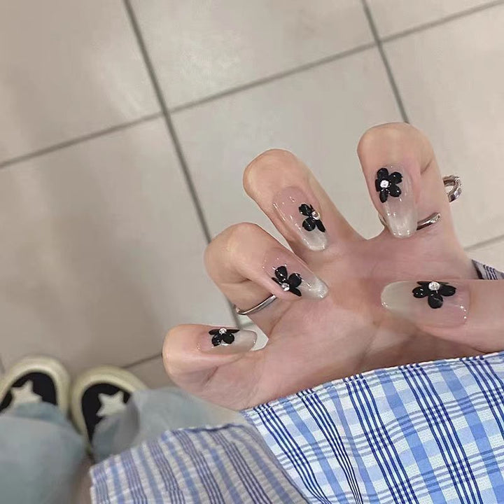 Artificial nails with elegant floral decorations Stornfield