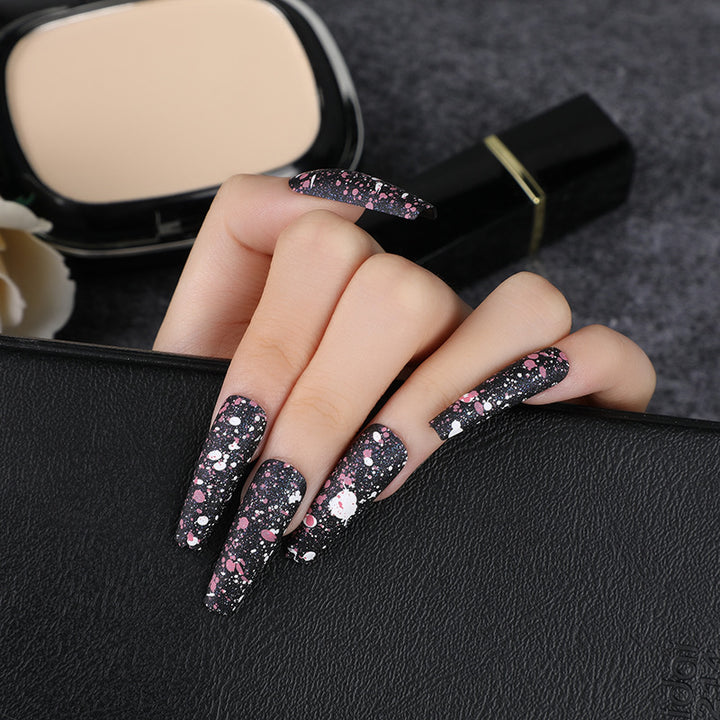 Artistic splatter design artificial nails Stornfield